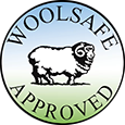 Logo with the words 'woolsafe approved' and a sheep